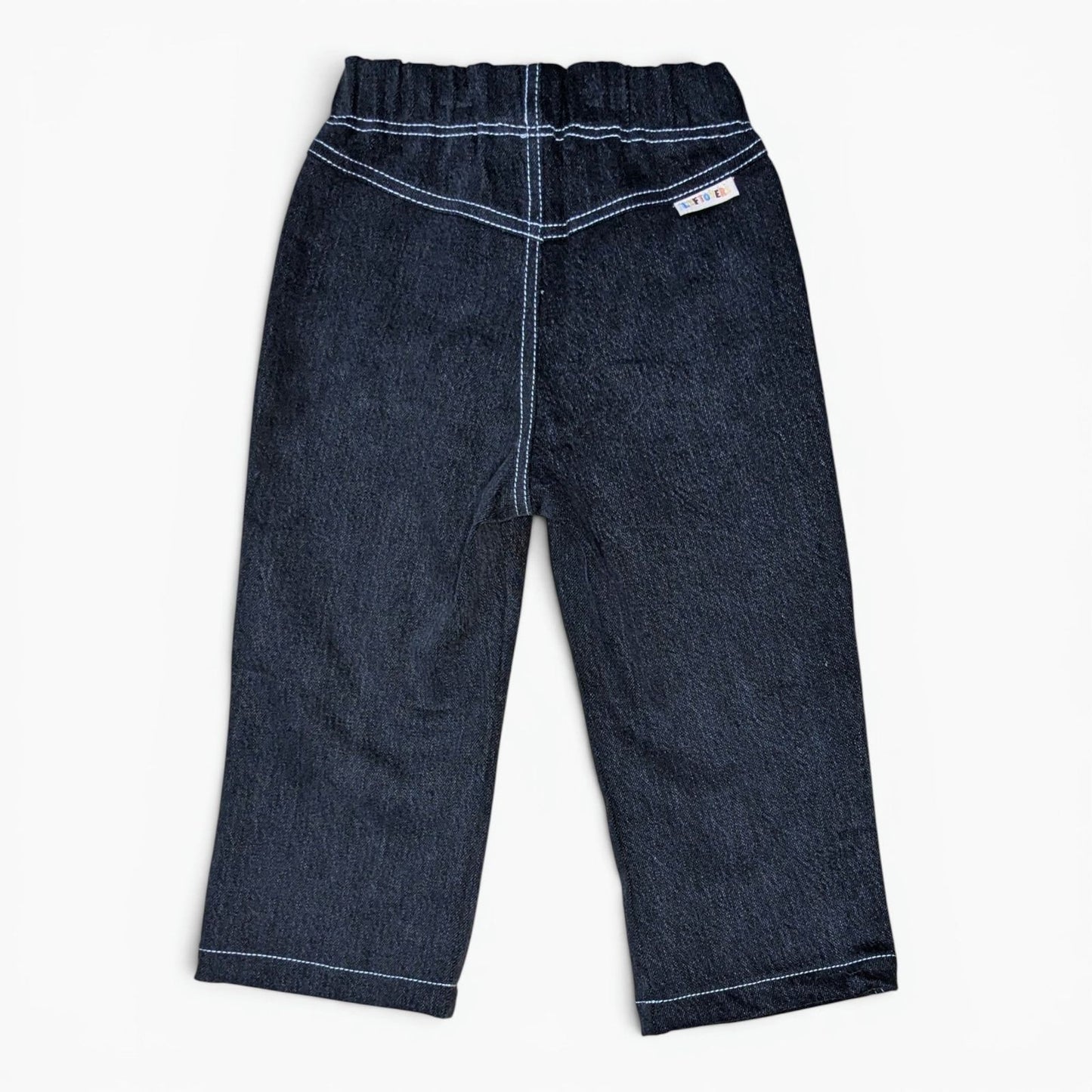 A pair of Leftovers Club Sammy Sailor black denim jeans for kids, featuring an elastic waistband, front pockets, and contrast