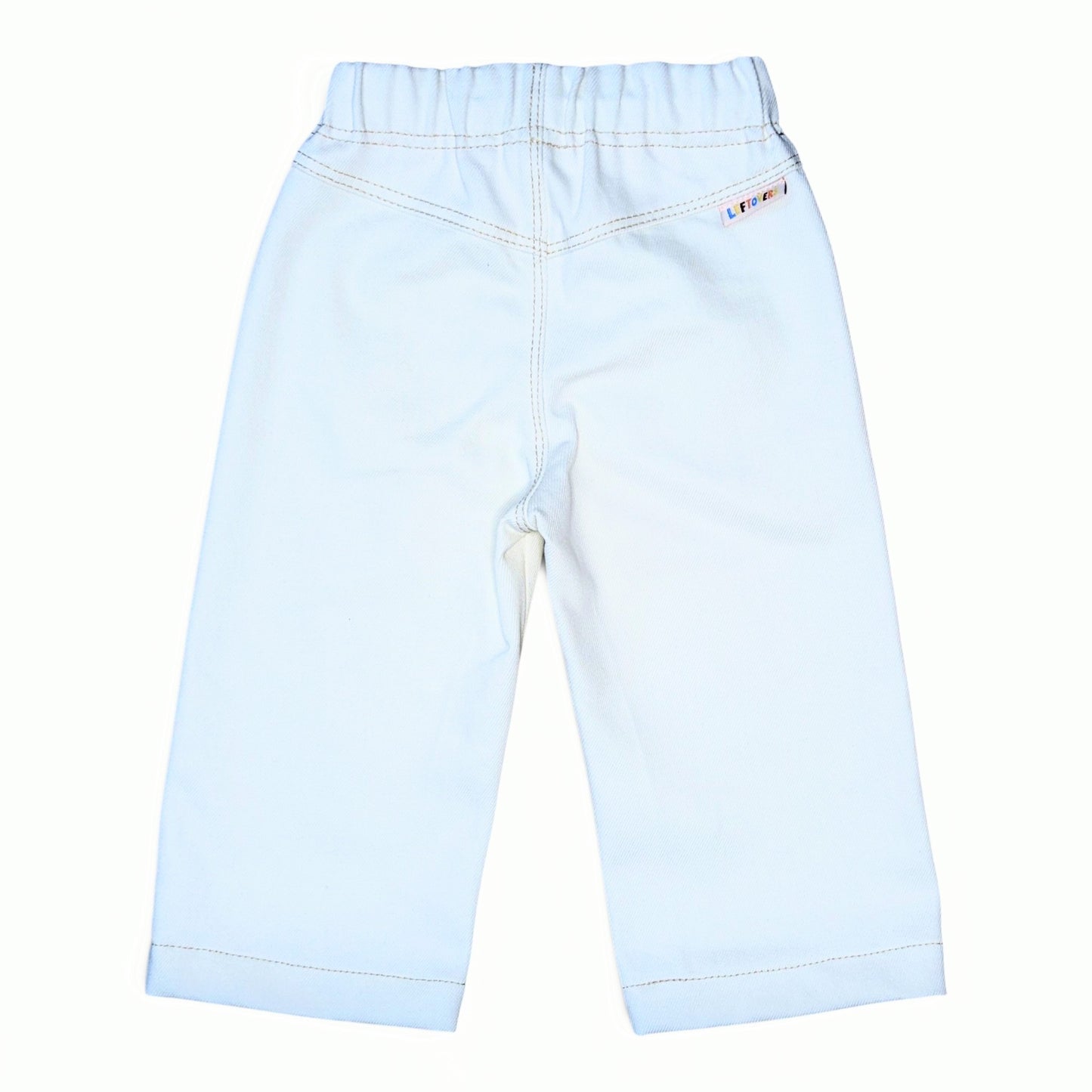 White denim pants shown from the back, featuring an elastic waistband, contrast stitching, and a small colorful brand tag on the upper right side.