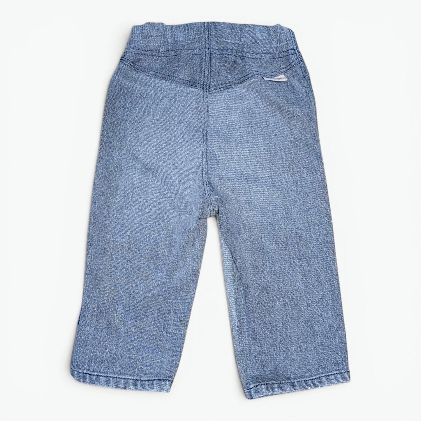 A pair of Leftovers Club Stevie Straight grey denim jeans for kids, featuring an elastic waistband, front pockets, and contra
