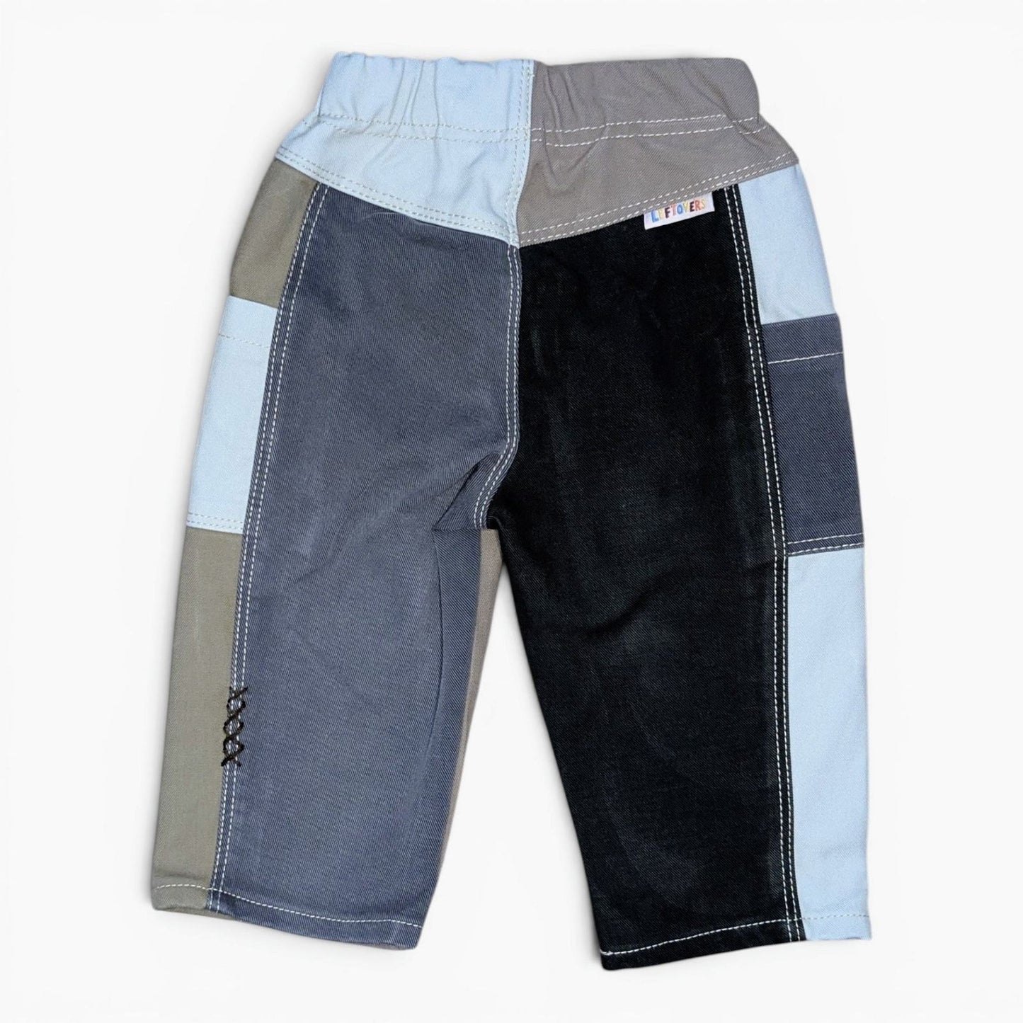 A pair of Leftovers Club Cameron Cargo blue, olive and black drill cargo pants featuring a wide elastic waistband, contrast s