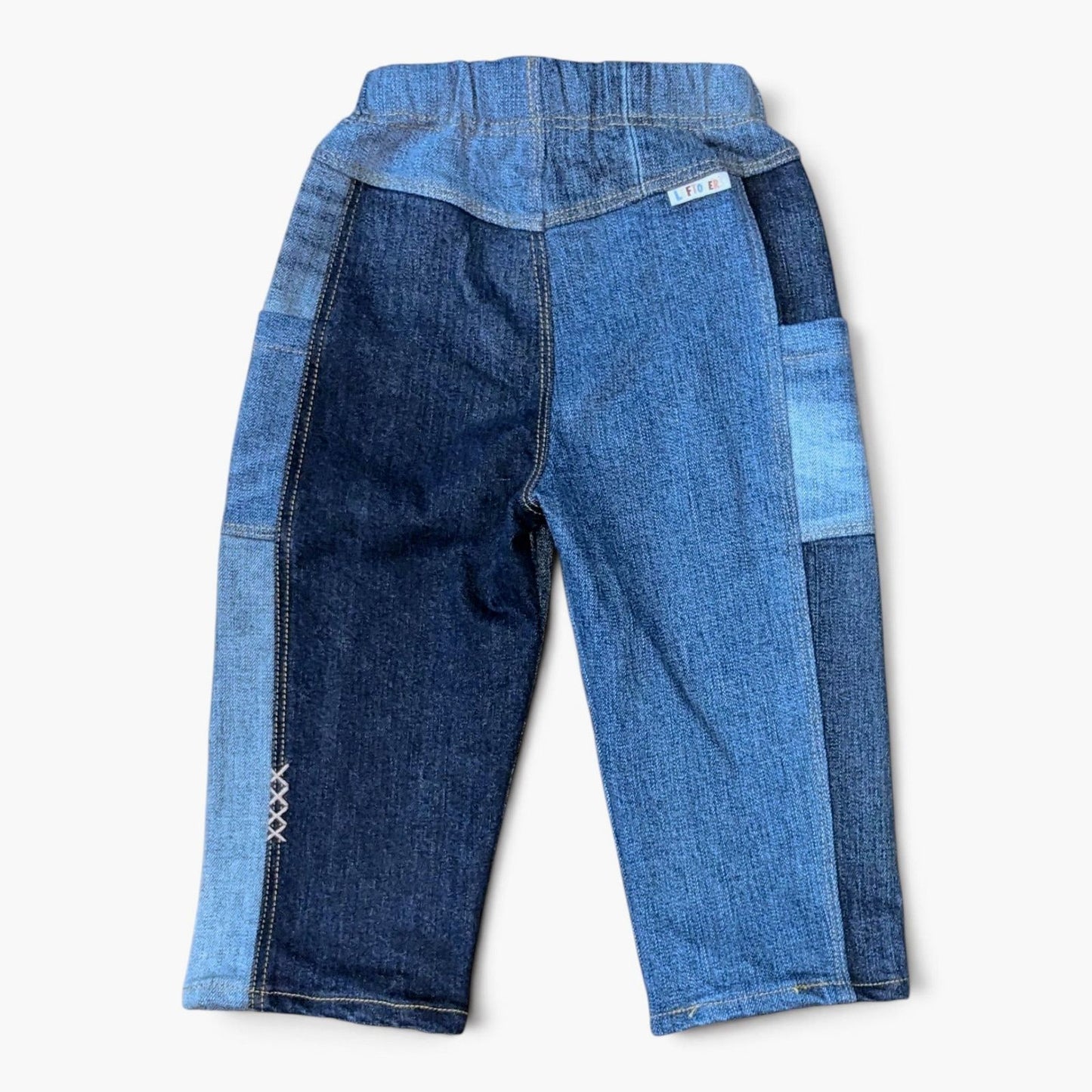 Leftovers club blue patchwork denim jeans for toddlers. Cameron Cargo style featuring side pockets and an elastic waistband.
