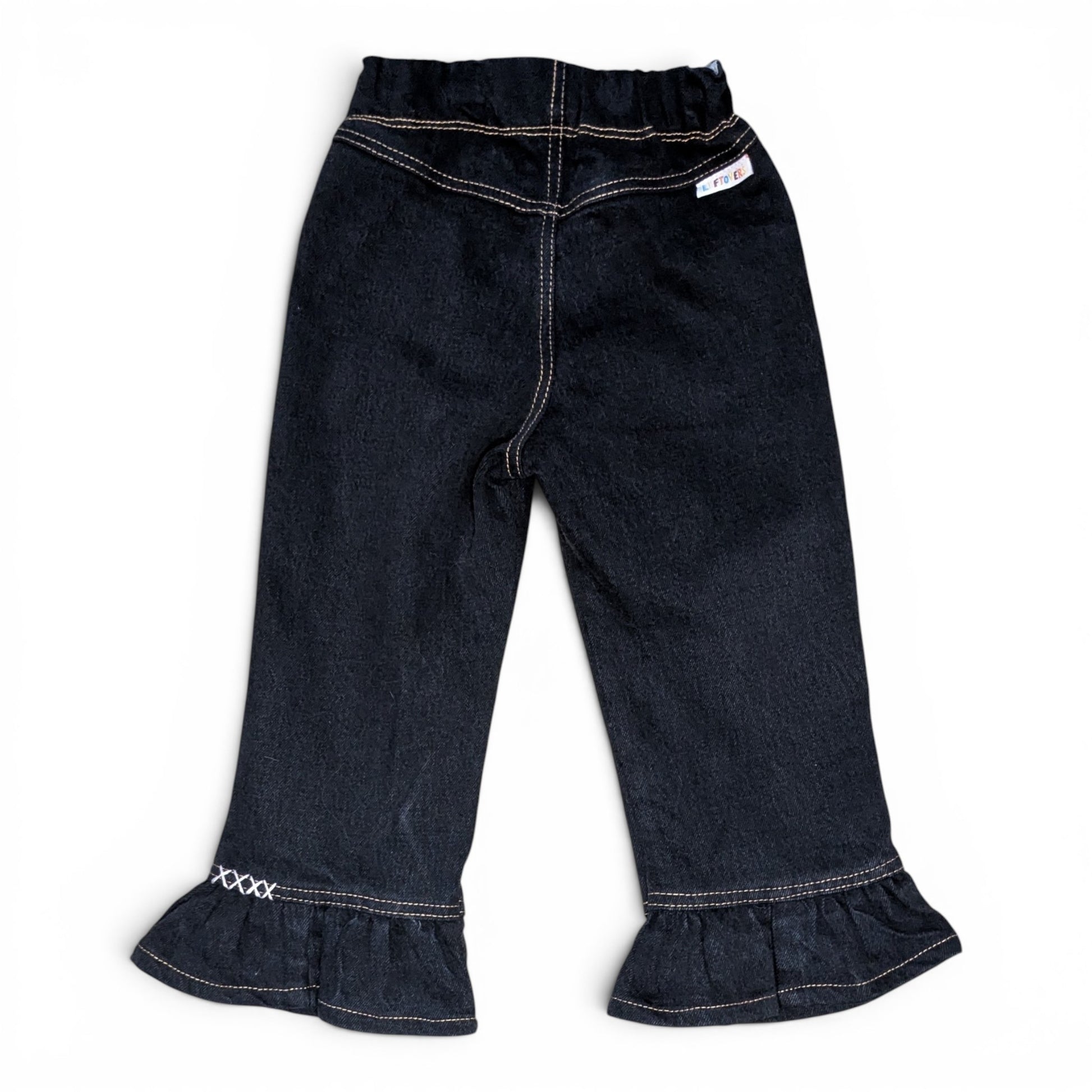 Dark wash denim cropped pants with a ruffled hem and white contrast stitching, shown flat on a white background.