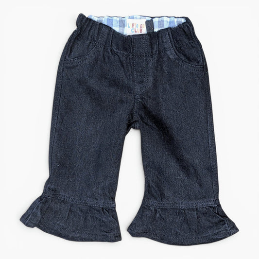 A pair of dark blue denim cropped pants with a ruffled hem and a light blue and white striped inner waistband, shown flat on a white background.