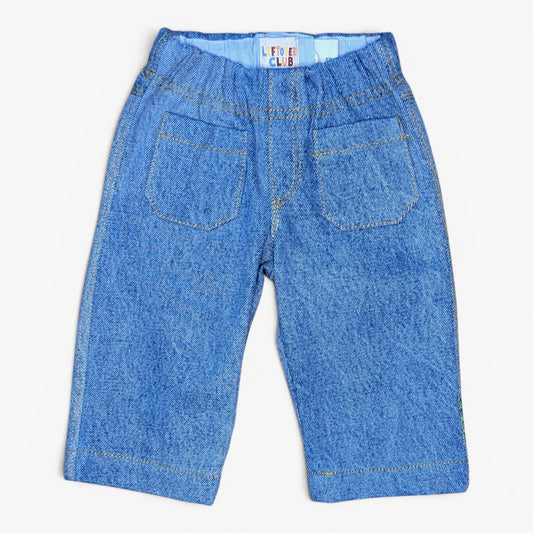 A pair of blue denim pants for kids, shown from the back with an elastic waistband, dual back pockets, and contrast stitching, laid flat on a white background.