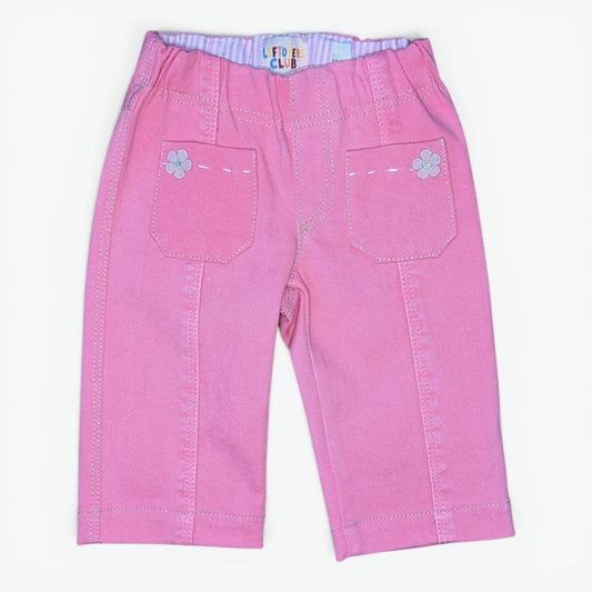 Pink denim capri pants for toddlers, featuring decorative flower appliques on the back pocket pockets and a striped inner waistband.