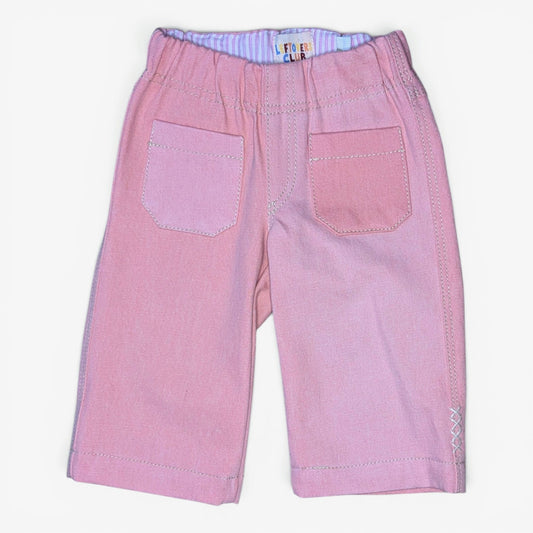 Pink denim jeans for kids with an elastic waistband, two front patch pockets, and contrast stitching, shown flat on a white background.
