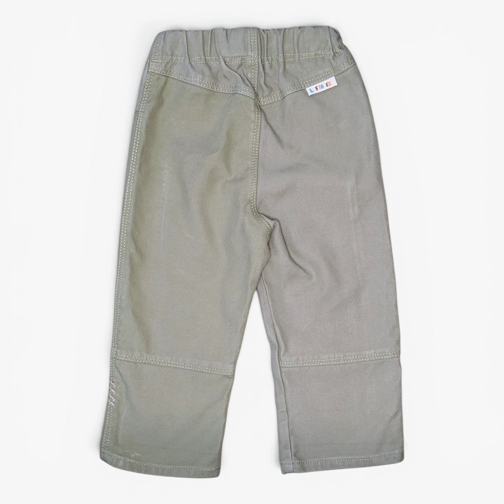 A pair of light gray toddler pants shown from the back, featuring an elastic waistband, side pockets, and reinforced seam patches on the legs, laid flat against a white background.