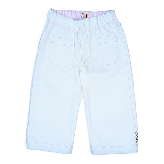 A pair of white denim pants for kids, shown from the back. The pants feature an elastic waistband with a pink and white striped inner lining, two large patch pockets, and contrast stitching.