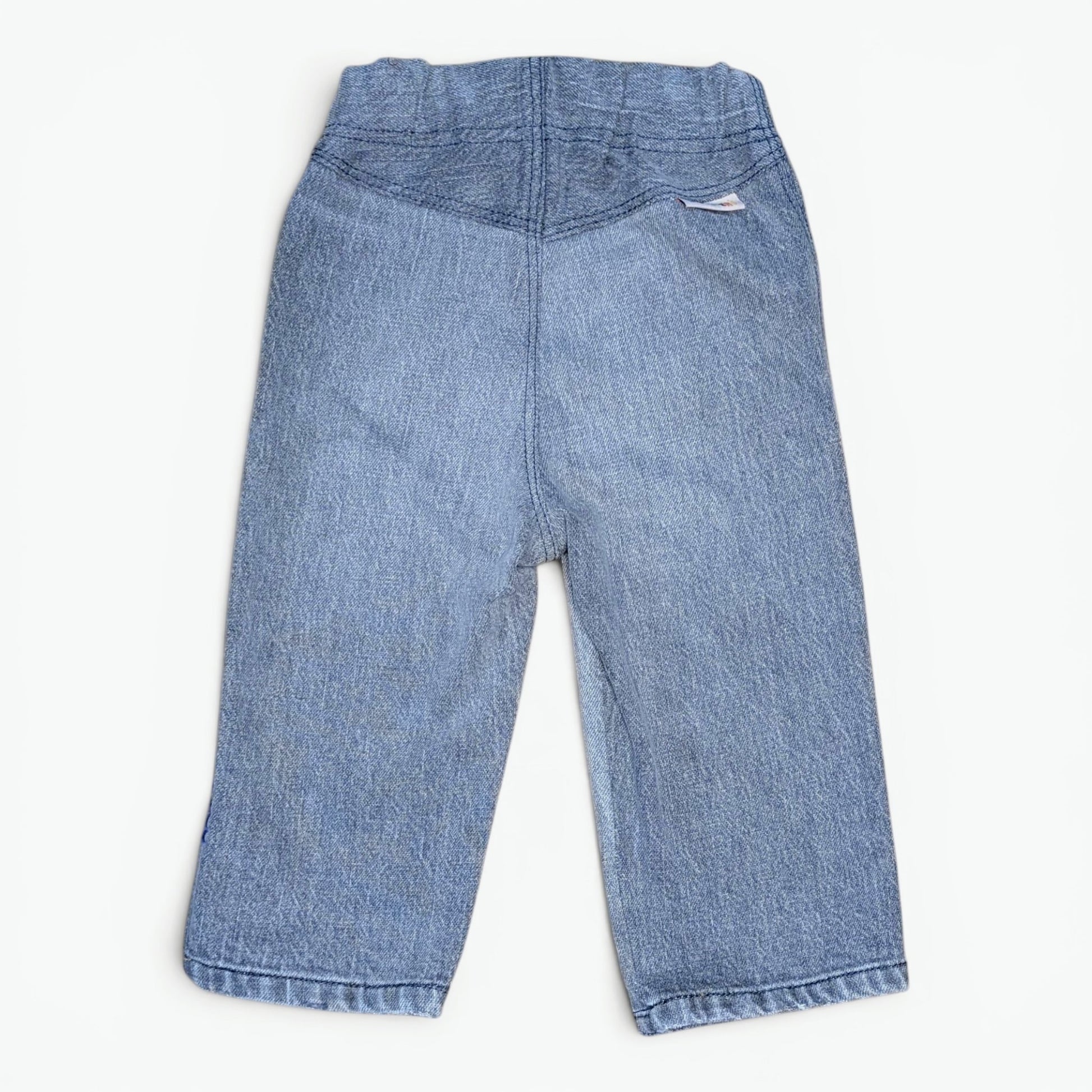 Light blue denim pants for toddlers, shown from the back on a clean white background.