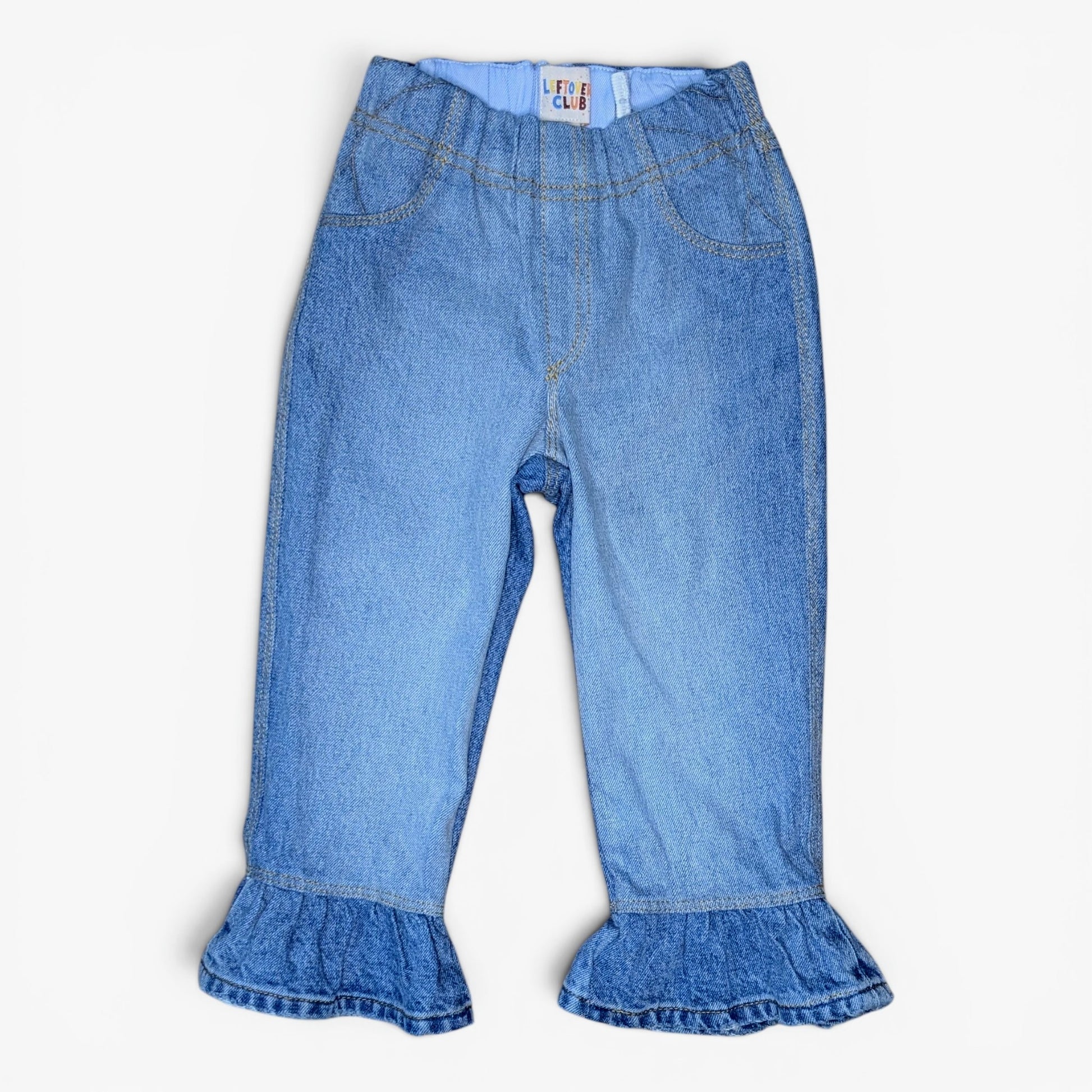 Light blue denim pants for toddlers  with ruffled hems, shown flat against a plain white background.