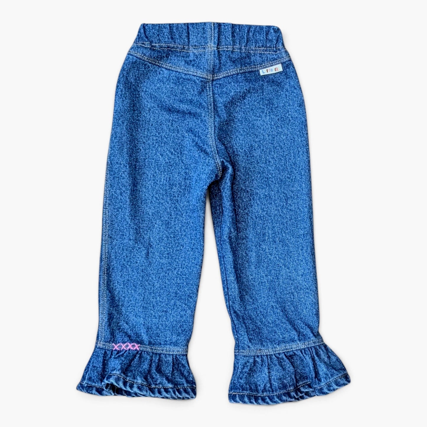 leftovers club frankie flare blue denim pants with ruffled hems, shown flat against a light gray background.