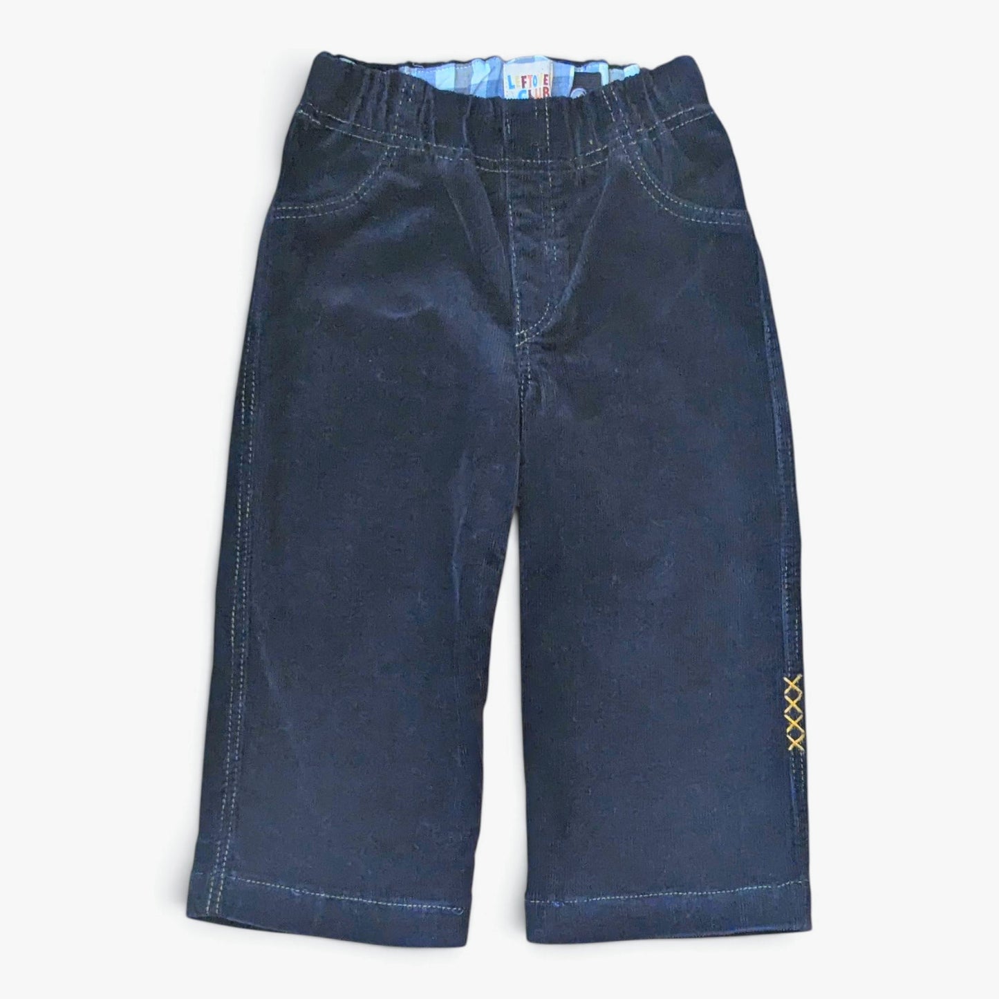 Leftovers club dark blue cord jeans for toddlers. Stevie straight style featuring an elastic waistband. Front view on white b