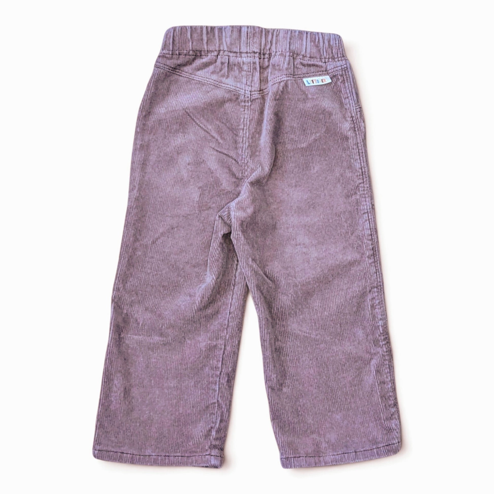 Leftovers club brown cord jeans for toddlers. Stevie straight style featuring an elastic waistband. Back view on white backgr