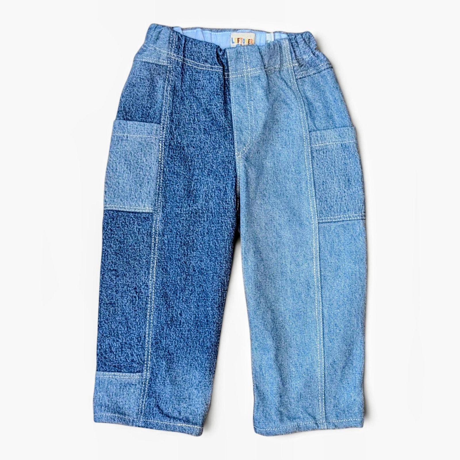 Leftovers club blue patchwork denim jeans for toddlers. Cameron Cargo style featuring side pockets and an elastic waistband.