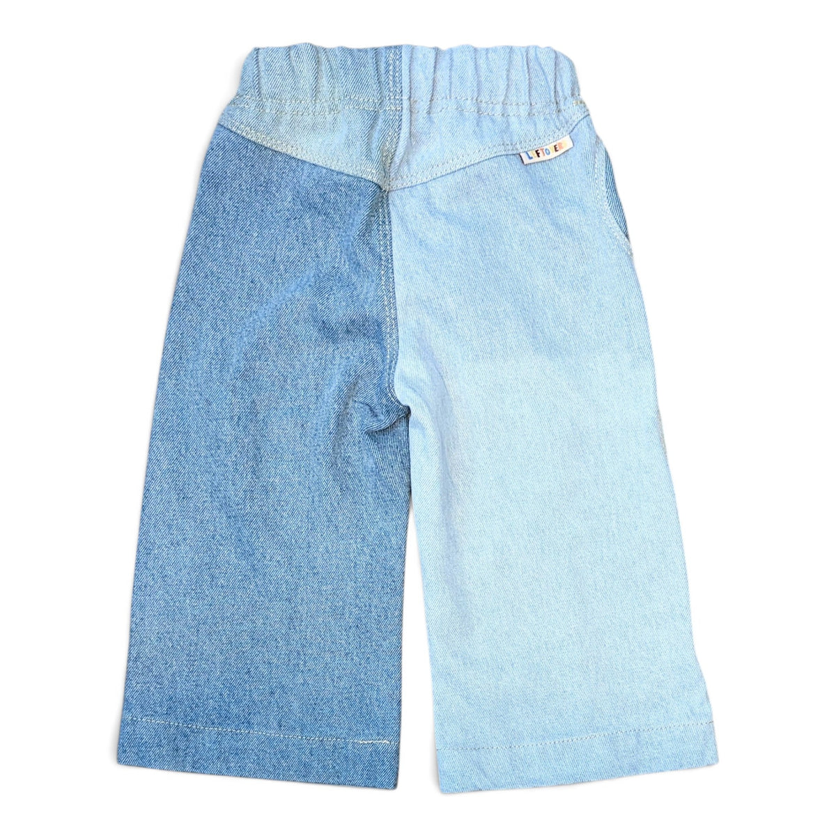 LEFTOVERS CLUB WINNIE WIDE AND WAVY TODDLER JEANS IN CONTRAST MID AND LIGHT BLUE DENIM WITH WAVY SIDE SEAMS, ELASTIC WAIST AND WIDE HEM