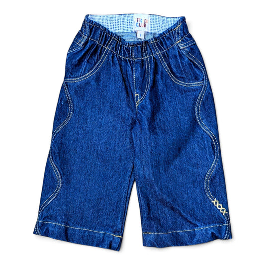 Leftovers Club Winnie Wide and Wavy Jean in a dark mid blue wash with wavy side seams and wide hem. 