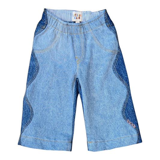 Leftovers Club Winnie Wide and Wavy Jean in a mixed light and mid blue wash with wavy side seams and wide hem. 